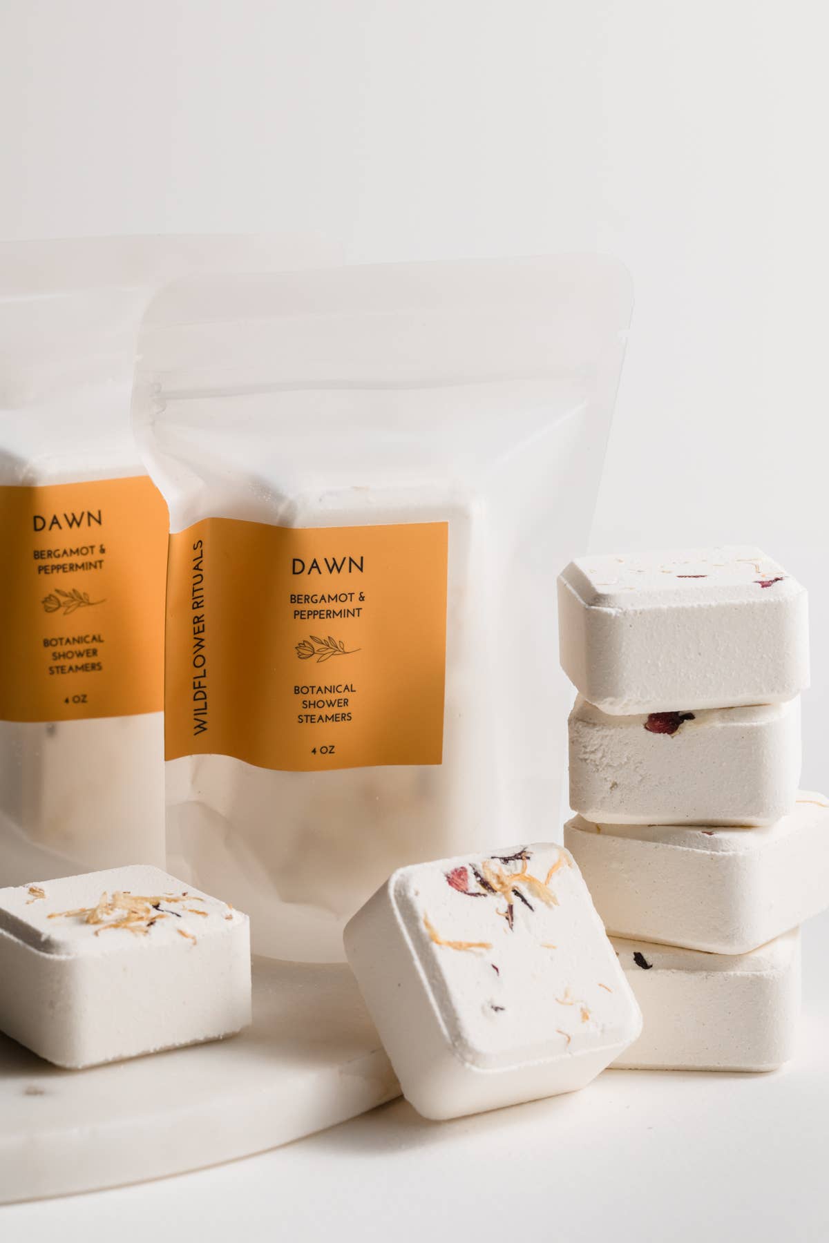Dawn shower steamers and packaging on a white background