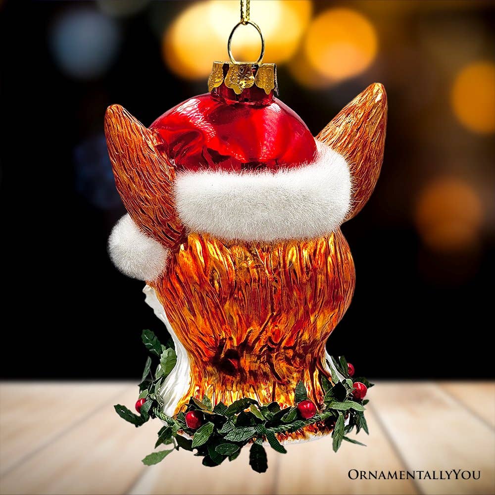 Decorative fox ornament wearing a Santa hat with a blurred background