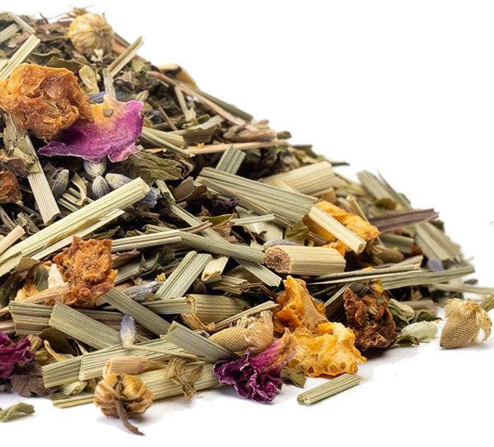 Assorted dried herbs and flowers on a white background