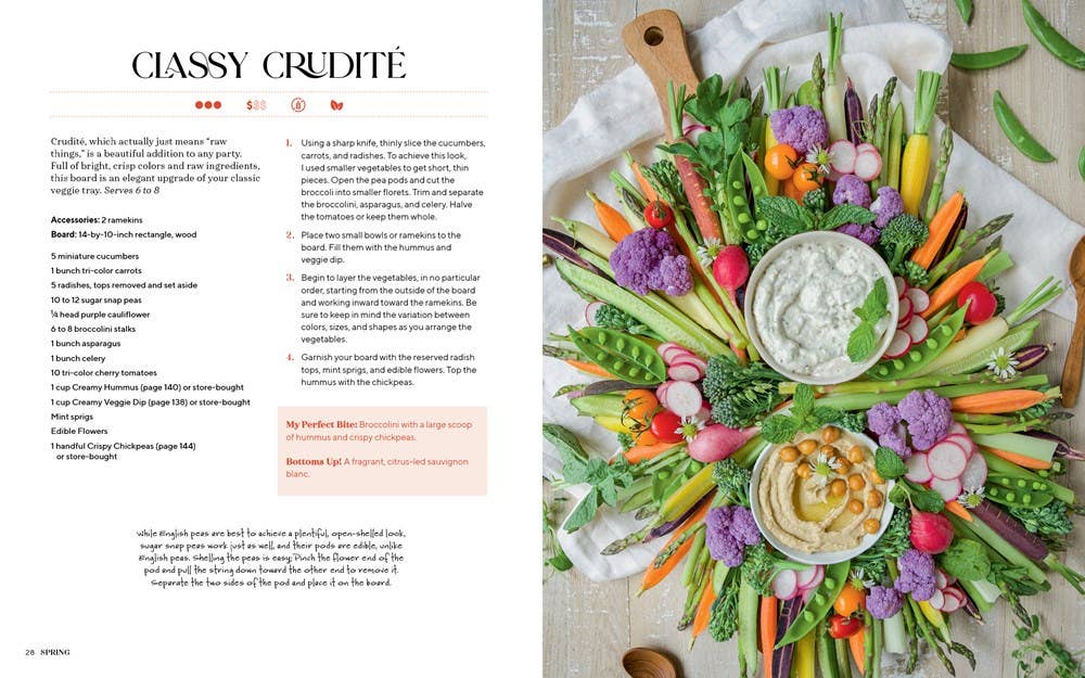 Vegetable platter with hummus in the center on a magazine page.