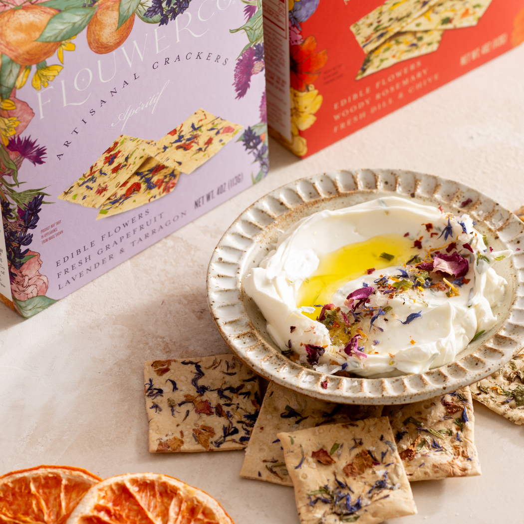 Flower crackers with a bowl of yogurt and flowers on a table