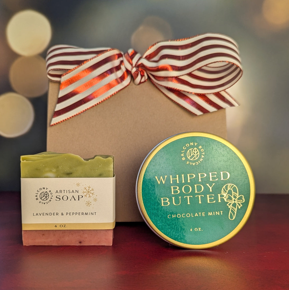 Lavender and peppermint bar soap and chocolate mint whipped body butter gift bundle with red and white bow.