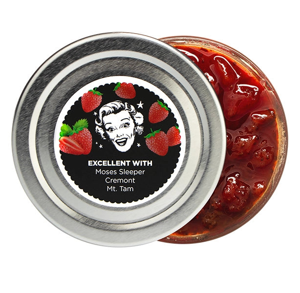 Jar of strawberry jam with a decorative label featuring a vintage-style illustration.