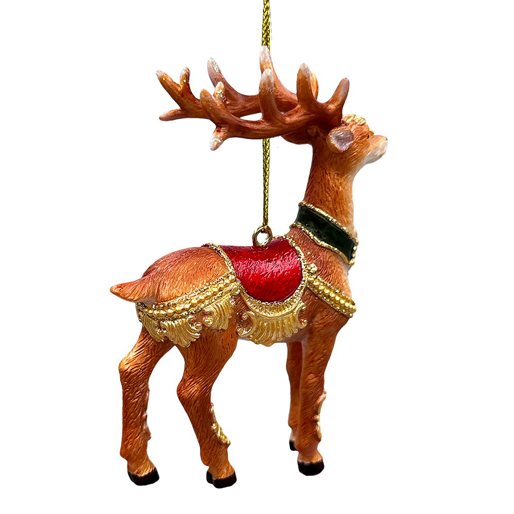 Decorative reindeer ornament with red saddle and gold accents on a white background