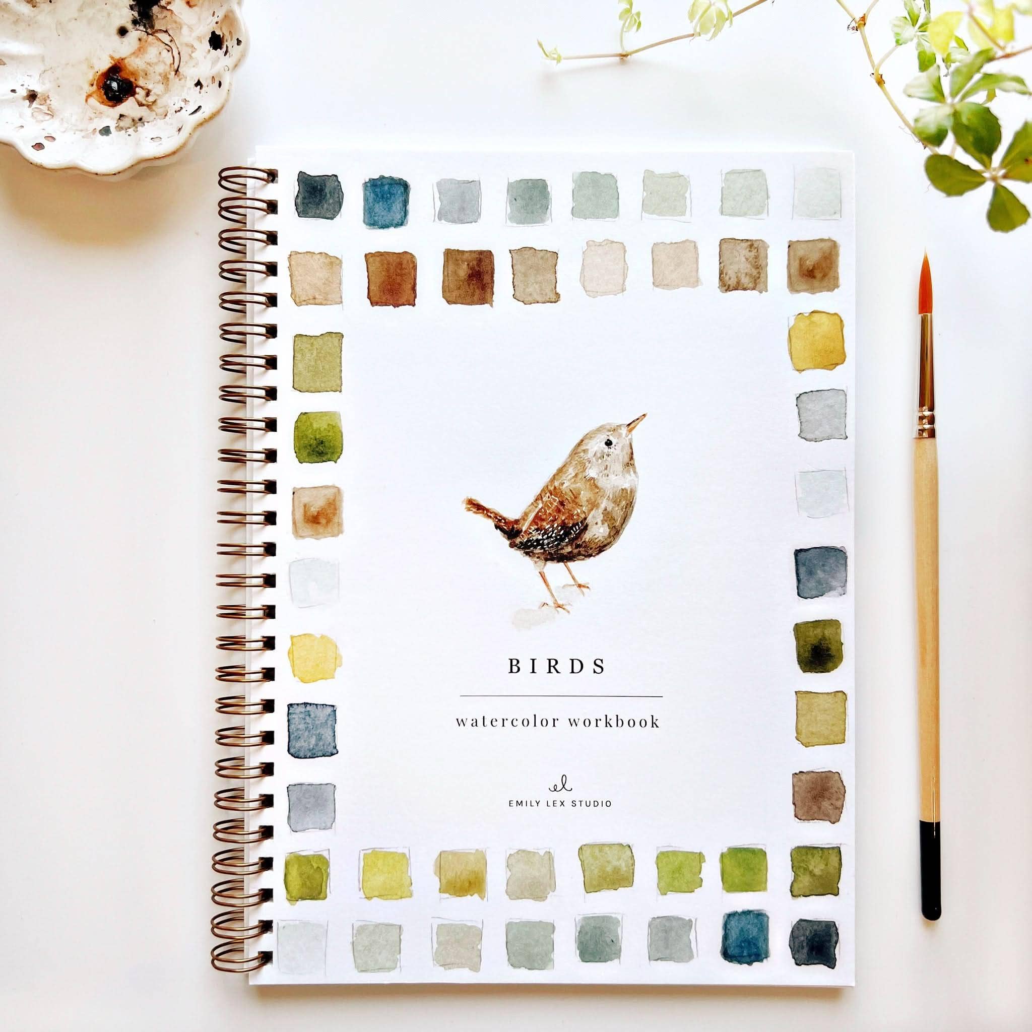 A spiral-bound watercolor workbook titled &