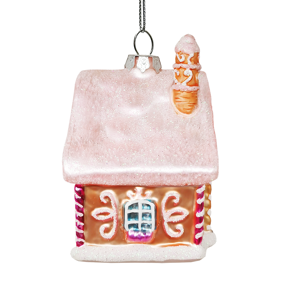 Gingerbread house ornament with a snow-covered roof on a white background