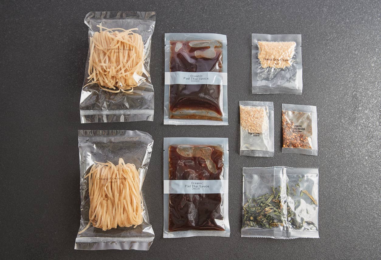 Assorted food packages on a gray surface