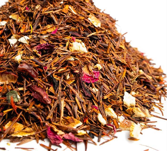 Heap of mixed dried herbs and flowers on a white background