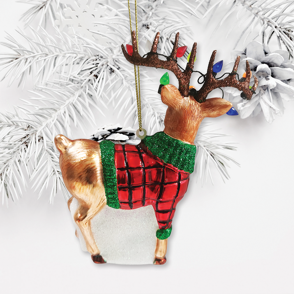 Decorative deer ornament with a red plaid sweater on a white background