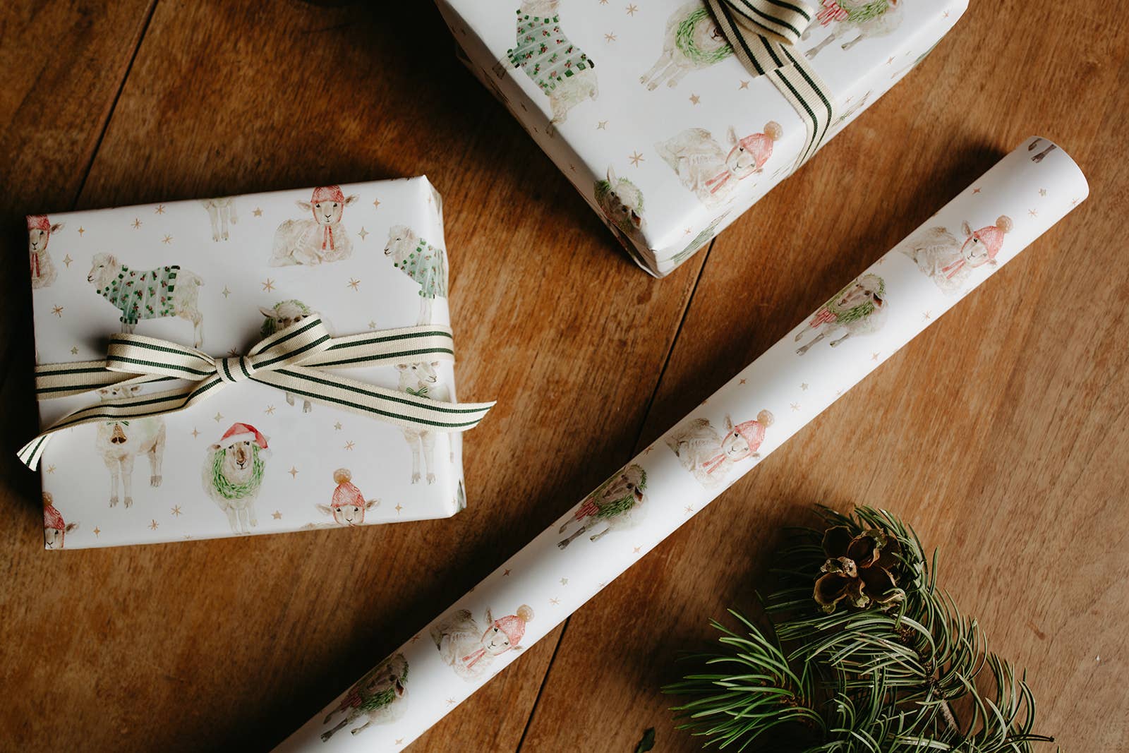 Gift wrap with festive design on a wooden surface