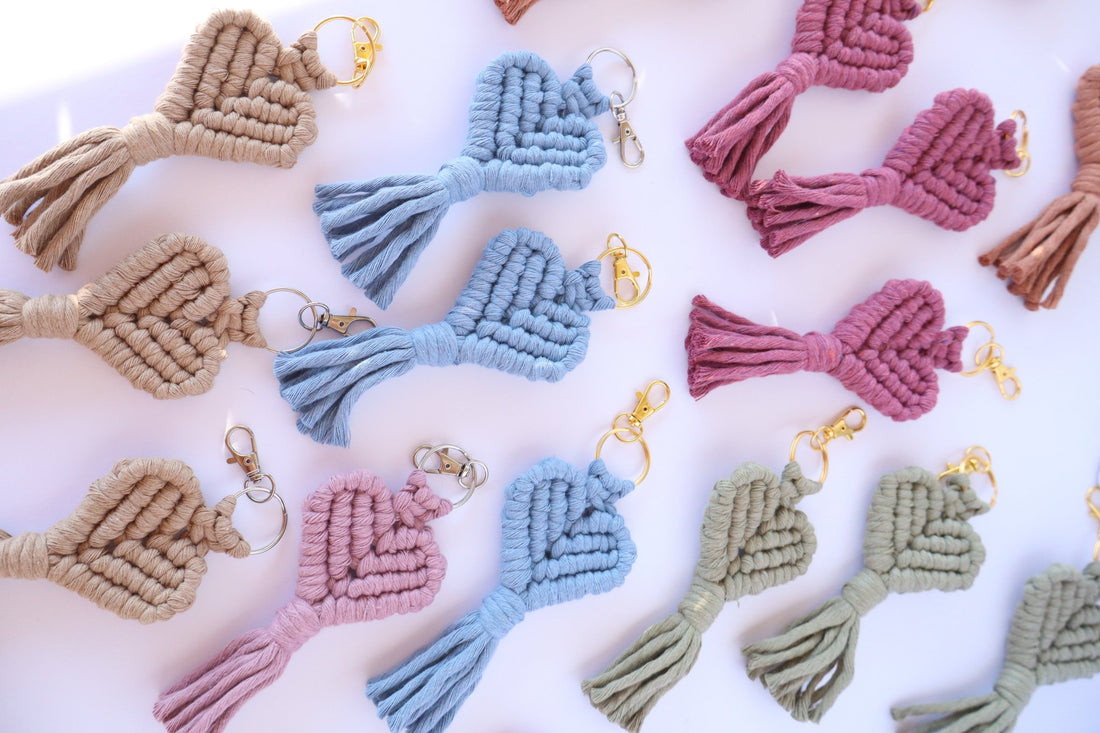 Collection of colorful macrame keychains on a white background