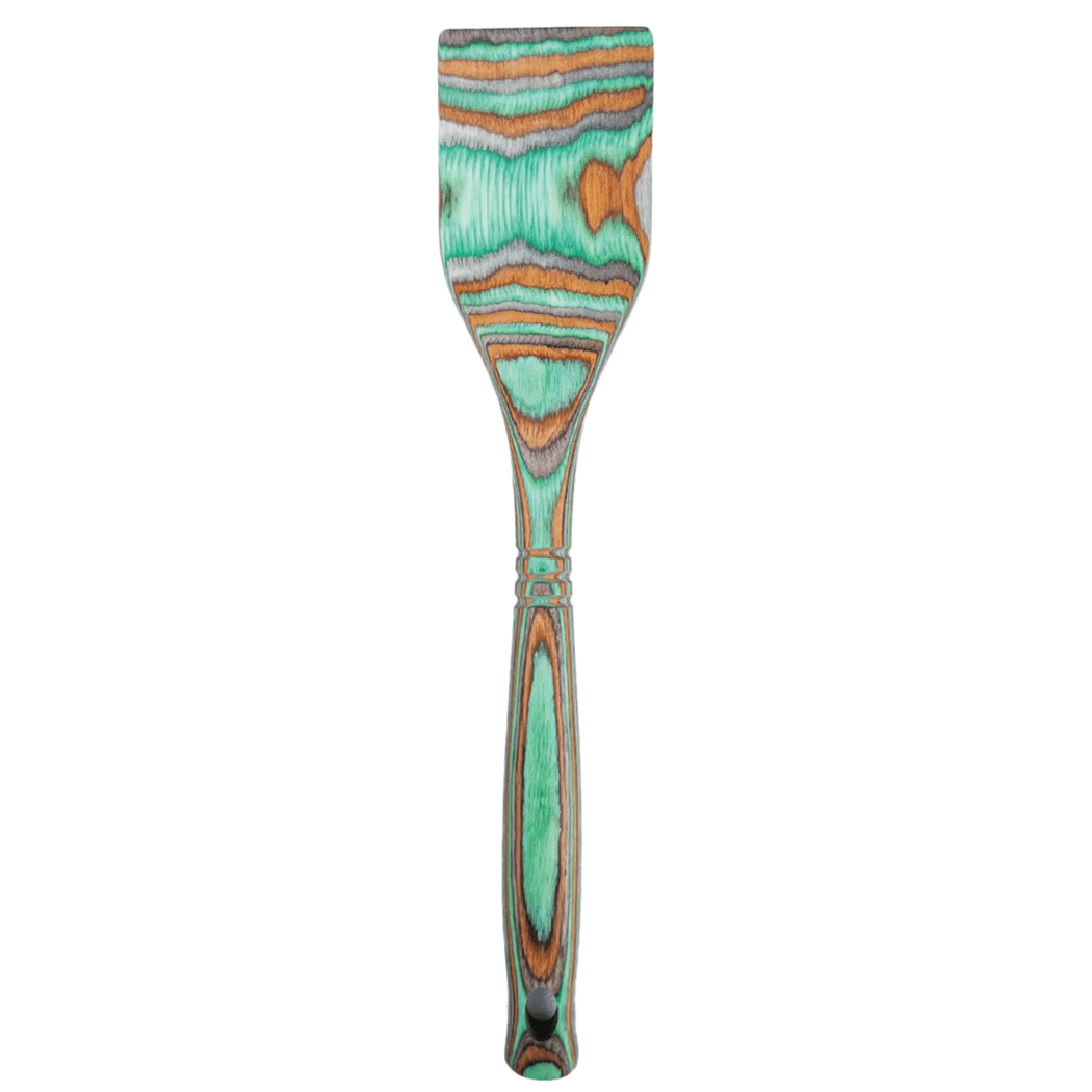 Colorful spatula with a patterned handle on a white background