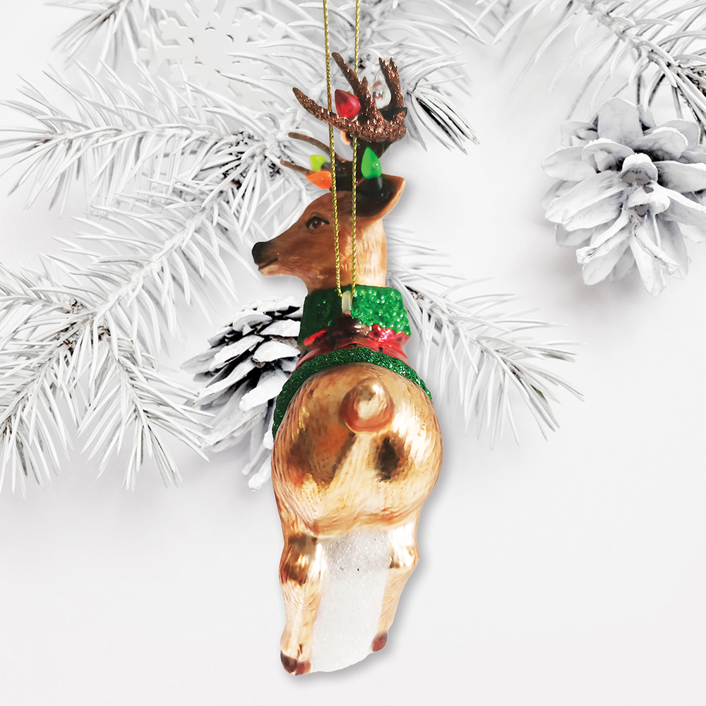 Decorative reindeer ornament with a green sweater on a white background