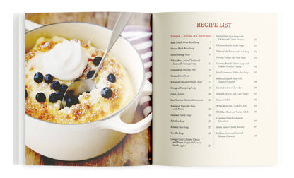 Open cookbook showing a bowl of dessert with berries and whipped cream, next to a recipe list.