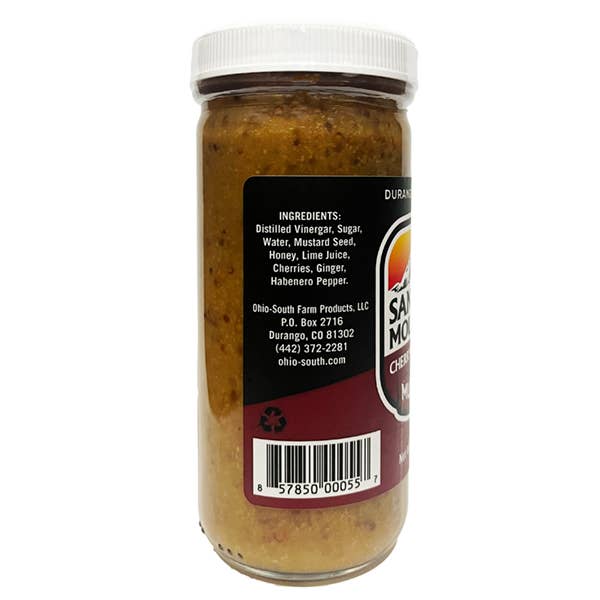Jar of sauce with a label showing ingredients and branding on a white background