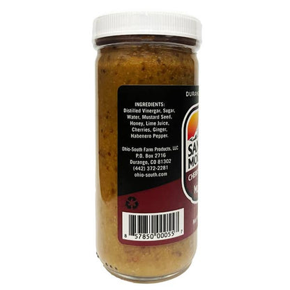 Jar of sauce with a label showing ingredients and branding on a white background