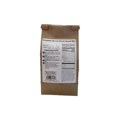 Brown paper bag with a label for pumpkin bread quick bread mix on a white background