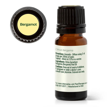 Bergamot essential oil bottle with label on a white background