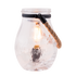 Clear glass jar with a light bulb inside on a white background