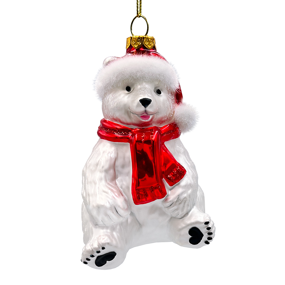 Glass polar bear ornament with a red scarf and gold top hat on a white background