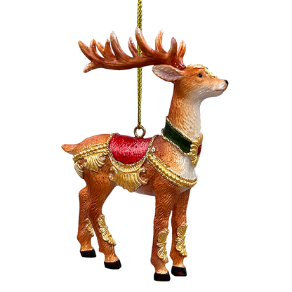 Decorative reindeer ornament with gold accents and a red sack on a white background