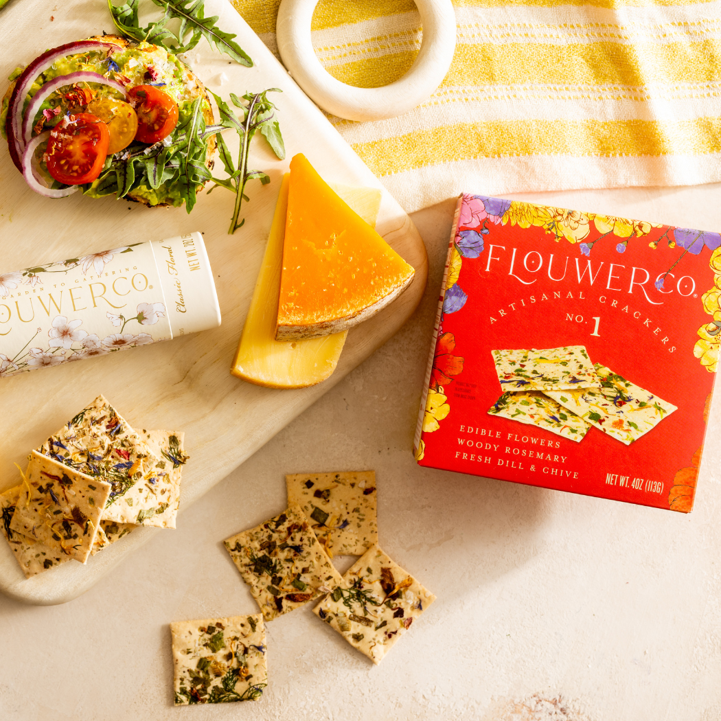 Flouwer &amp; Co crackers with a box and cheese on a table