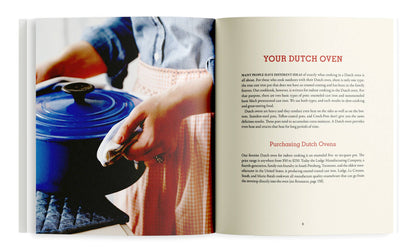 Open book showing a person holding a blue Dutch oven lid with text about Dutch ovens.
