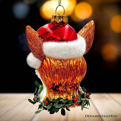 Decorative fox ornament wearing a Santa hat with a blurred background