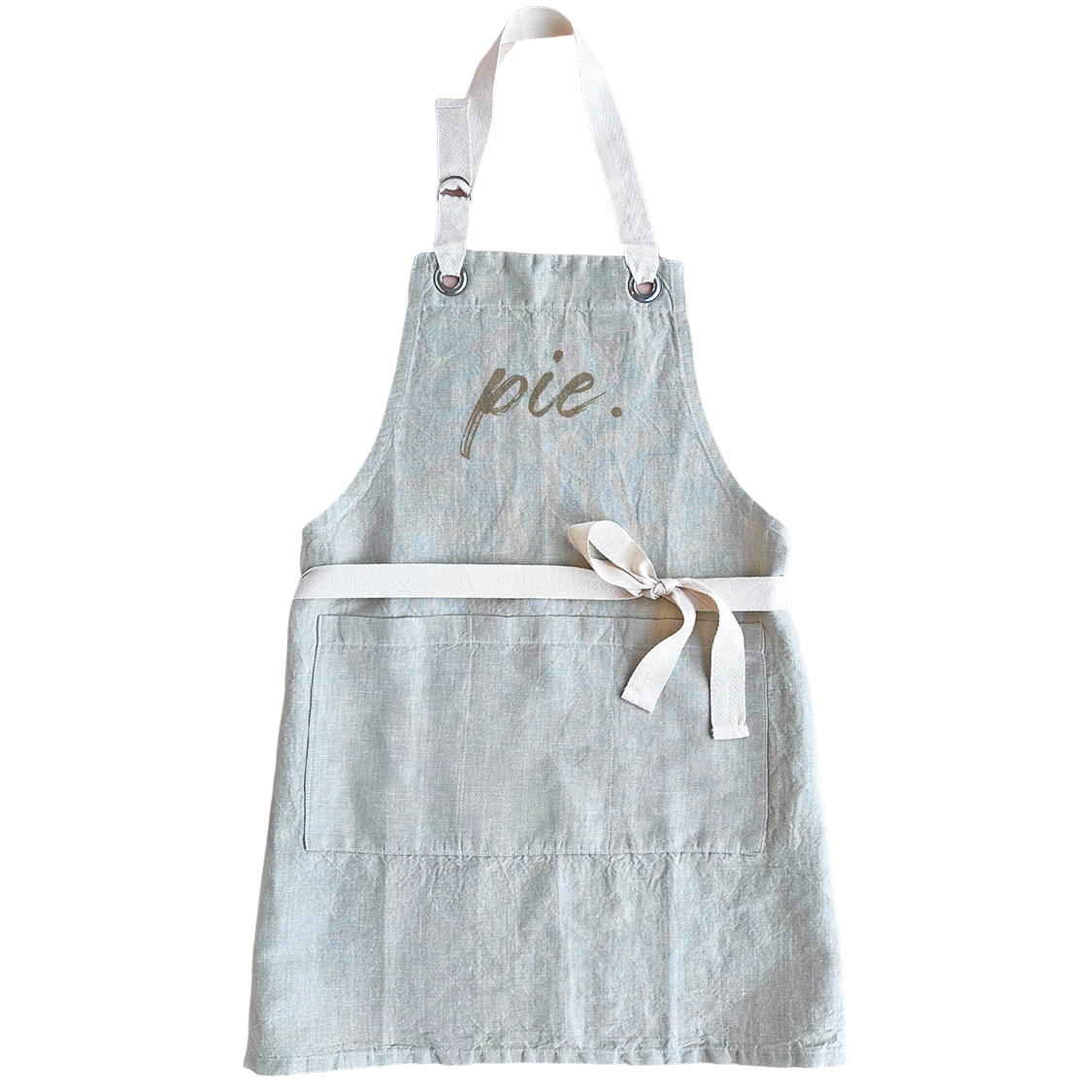 A light blue-gray linen apron with white straps and a white waist tie, featuring the word &