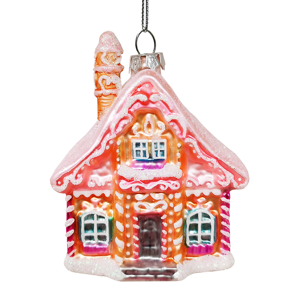 Gingerbread house ornament with pink roof and white trim on a white background