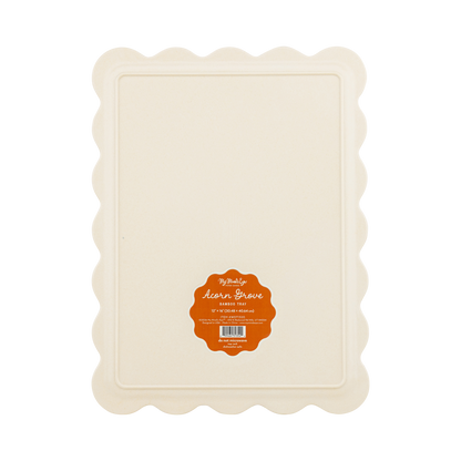 Rectangular beige tray with scalloped edges and a label on a white background
