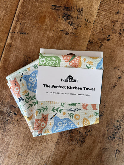 Packaged kitchen towels with a brand label on a wooden surface