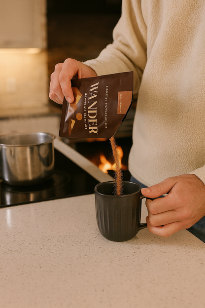 Person pouring coffee from a &