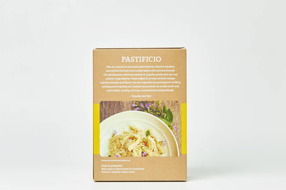 A box of Pastificio pasta on a clean white background. The kraft paper box features the brand name &