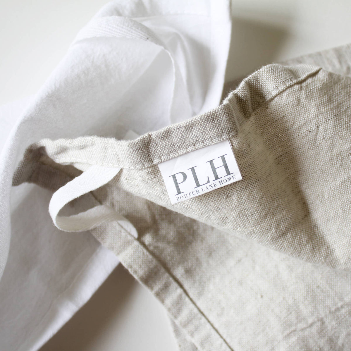 Close-up of a beige fabric with a &