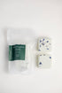 Two shower steamers with floral design on a white background, one still in packaging.