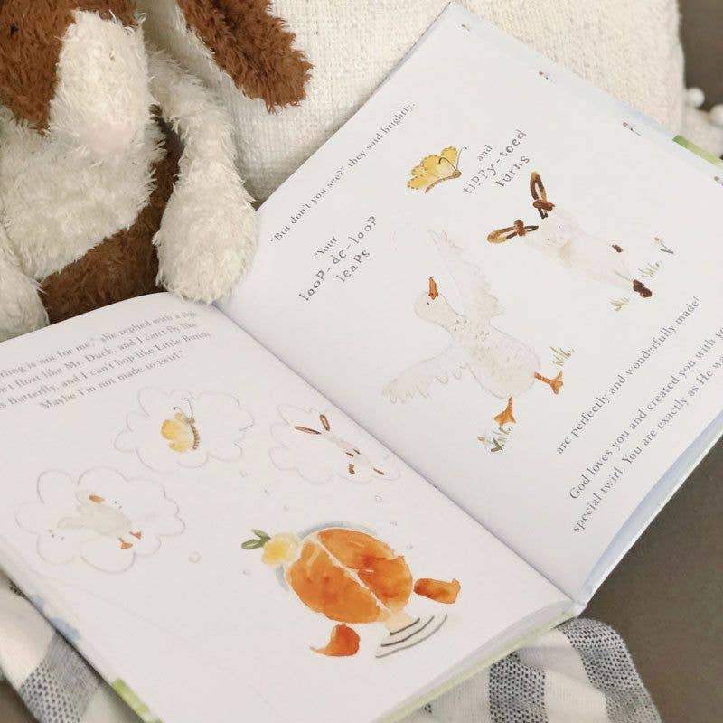 Open book with animal illustrations on a soft surface