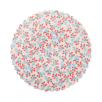 Round bamboo plate with red and blue floral pattern on a white background
