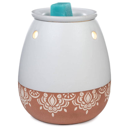 White and terracotta-colored wax warmer with a decorative pattern on a white background