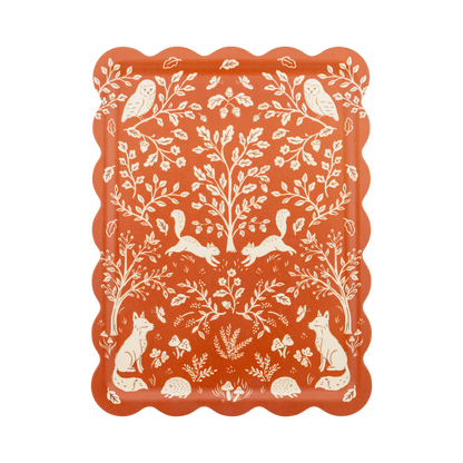 Decorative tray with white animal and nature pattern on a red background