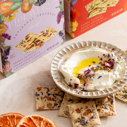 Flower crackers with a bowl of yogurt and flowers on a table
