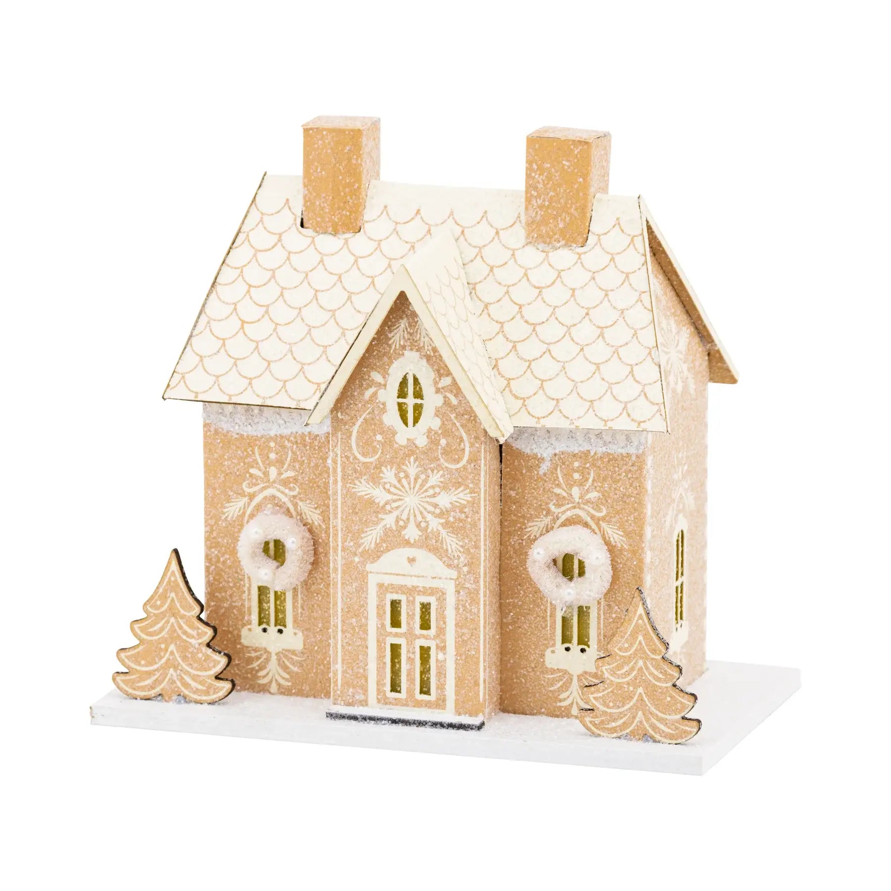 Decorative gingerbread house with snowflake patterns on a white background