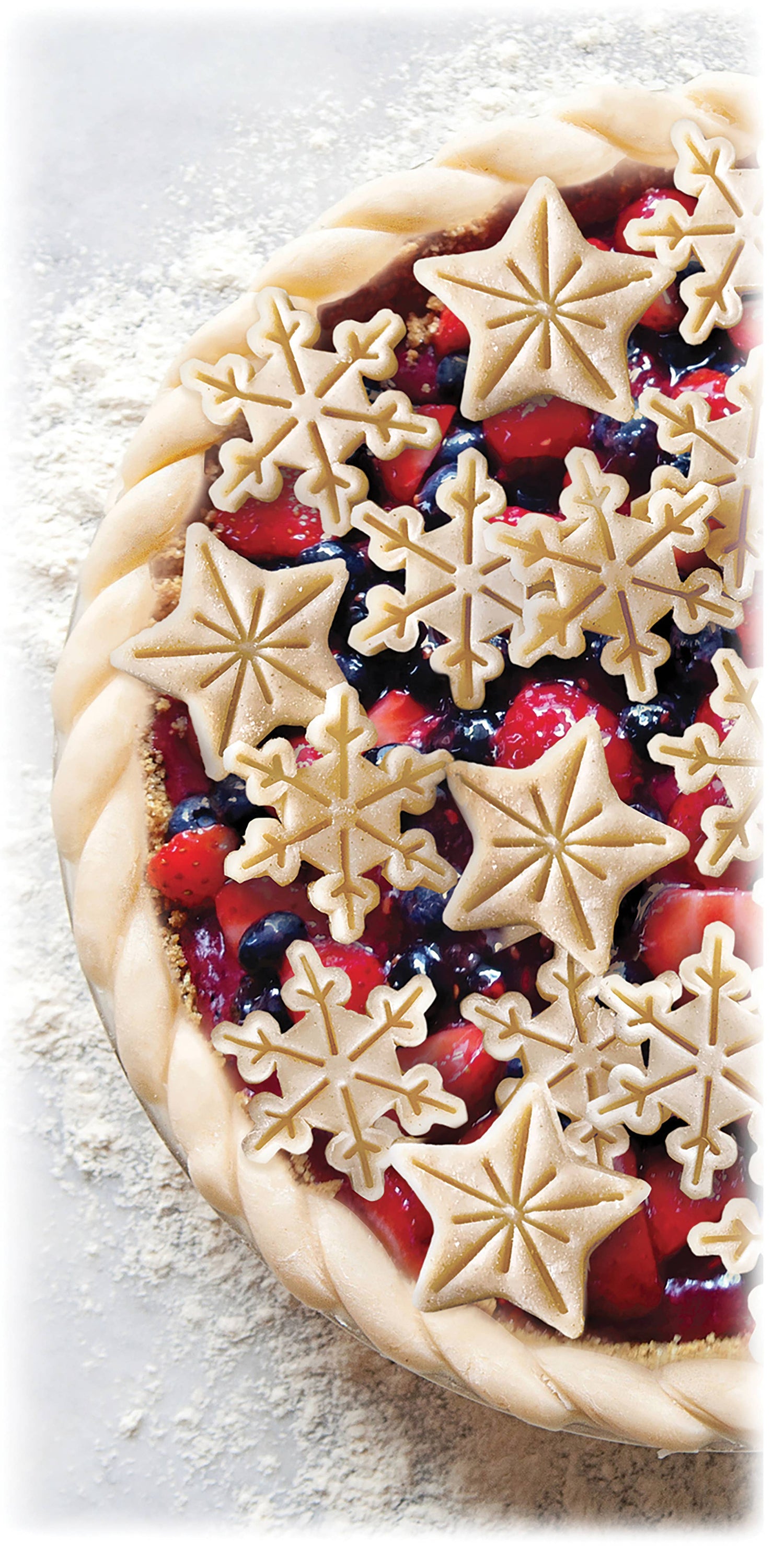 Berry pie with star-shaped pastry decorations on a light background