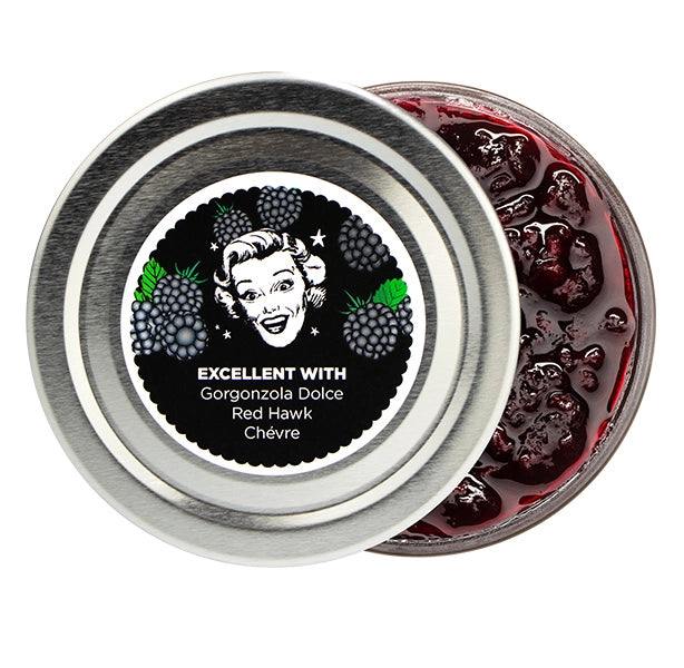 Jar of blackberry jam with a label featuring a vintage-style illustration and text.