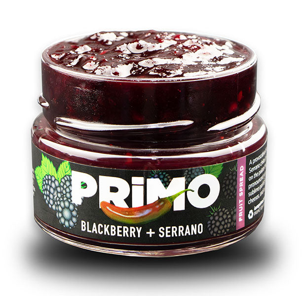 Jar of Primo blackberry and serrano fruit spread on a white background