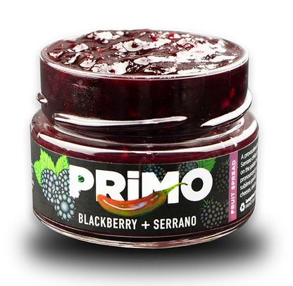 Jar of Primo blackberry and serrano fruit spread on a white background