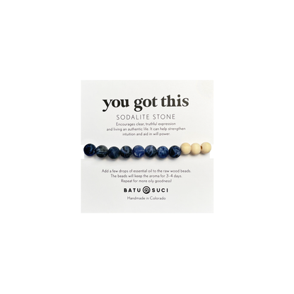 Beaded bracelet with sodalite stone on a white card with &