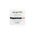 Beaded bracelet with sodalite stone on a white card with &