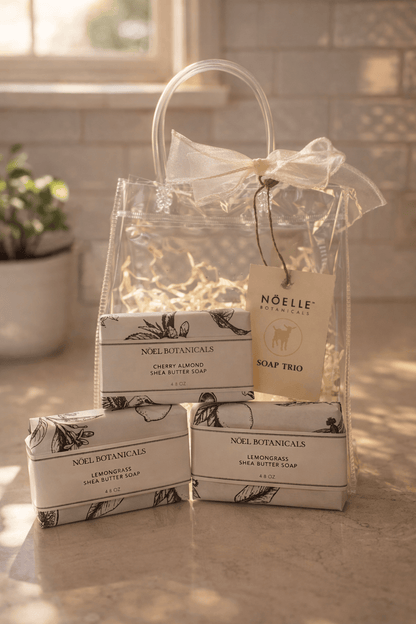 Gift set of Noelle Botanicals soap bars with a clear bag on a countertop.