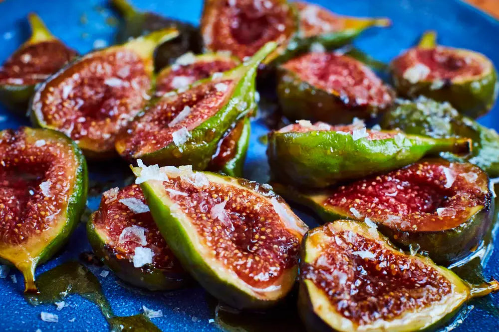 Figs with salt on a blue plate